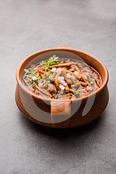 Spicy Sev Bhaji or Ganthiya Nu Shaak recipe from India photo